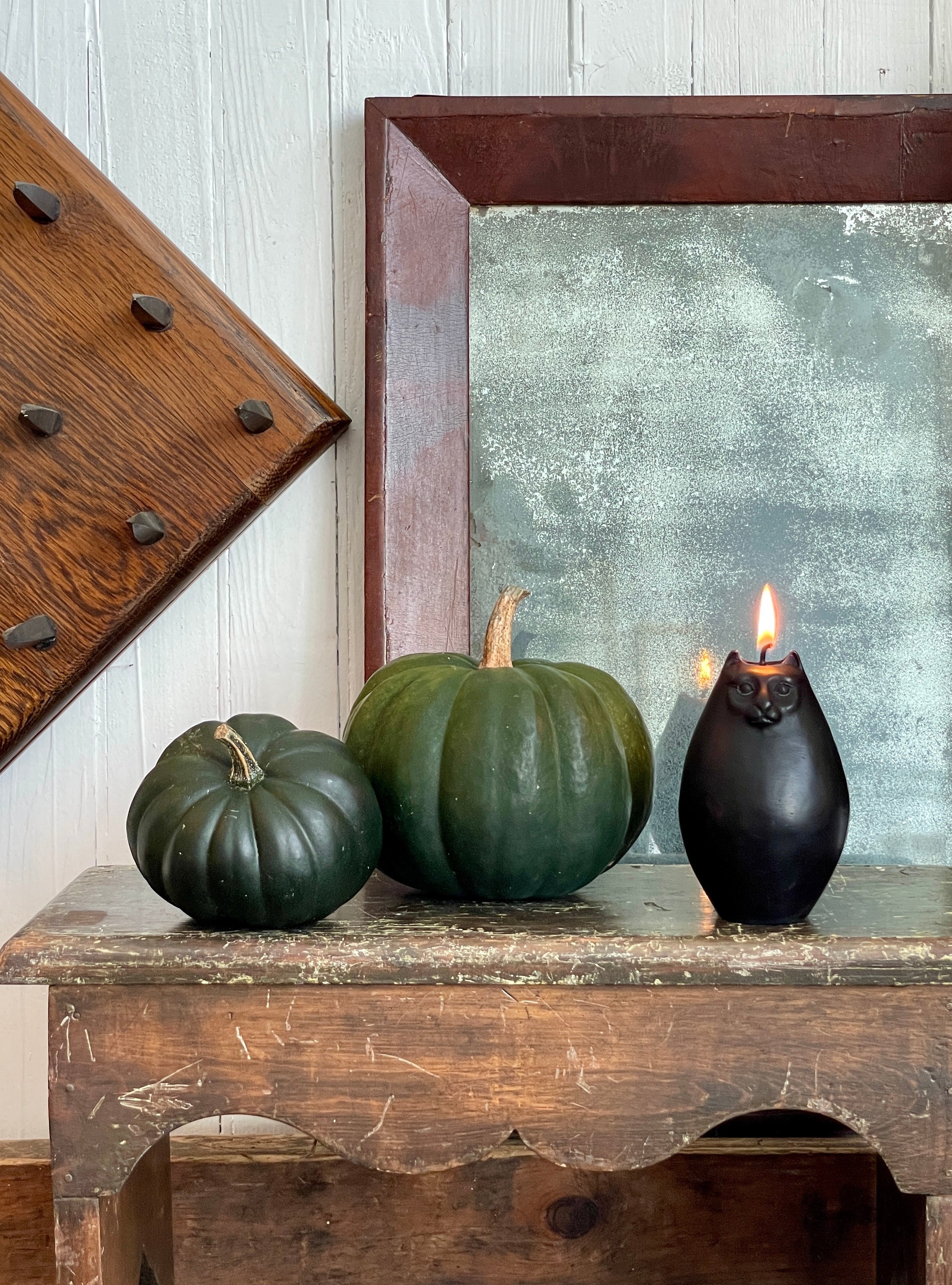 Green pumpkins with black cat candle